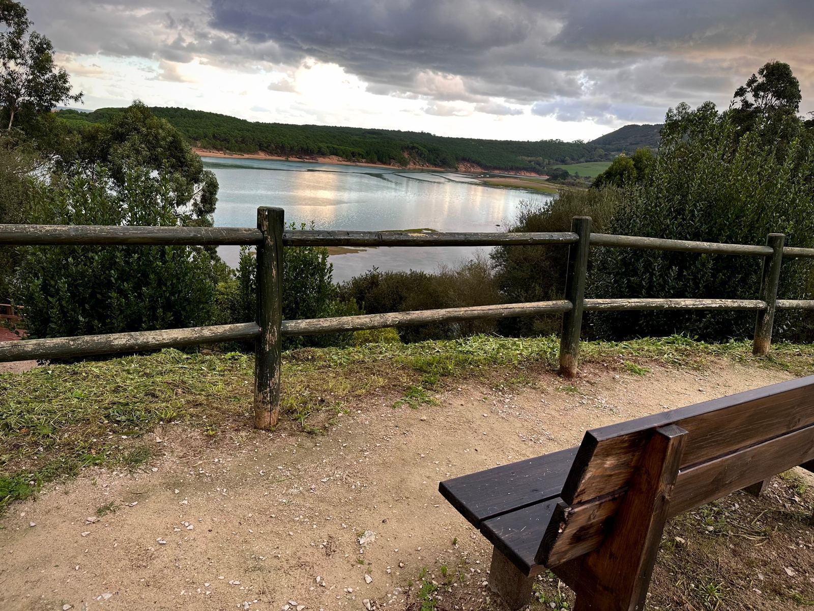 A wooden bench at a lookout above the estuary, a short walk from the house.